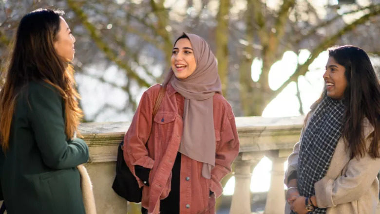 students-three-girls-smiling-outside-kcl-csi-780x450.xee2415f1.webp